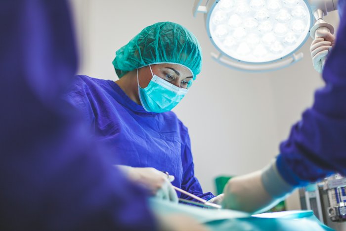 A surgeon in an operating theatre
